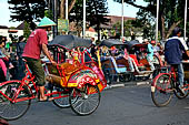 Riding the becak, the local cycle rickshaws in Malioboro street Yogyakarta. 